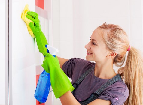 Cleaner using safety-focused equipment during a professional cleaning service