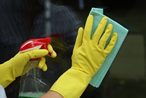 Professional home cleaners in Bromley preparing a living room for cleaning